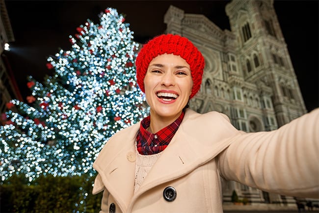 shutterstock_342055598-selfie-with-a-xmas-tree-HERO